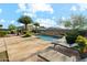 Inviting pool area with a water feature, lounge chairs, lush greenery, and a mountain view at 27308 N 56Th Dr, Phoenix, AZ 85083