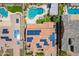 Aerial view showcasing a property with a pool, spa, outdoor kitchen, and solar panels at 27809 N Silverado Ranch Rd, Peoria, AZ 85383