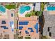 Aerial view of home with a pool and solar panels showcases roof and neighborhood at 27809 N Silverado Ranch Rd, Peoria, AZ 85383