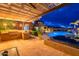 Backyard featuring pool, hot tub, built-in grill, and pergola, creating an ideal outdoor oasis at 27809 N Silverado Ranch Rd, Peoria, AZ 85383