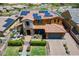Aerial of a two story home featuring tile roof, lush landscaping, and a three car garage at 27809 N Silverado Ranch Rd, Peoria, AZ 85383