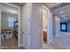Hallway has two doors, one to a storage closet and one to a bathroom at 27809 N Silverado Ranch Rd, Peoria, AZ 85383