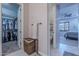 Hallway featuring a walk-in closet, access to a bathroom and the main bedroom at 27809 N Silverado Ranch Rd, Peoria, AZ 85383