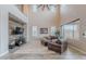 Open floorplan with a two story ceiling, hardwood floors, and abundant natural light at 27809 N Silverado Ranch Rd, Peoria, AZ 85383