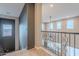 Second story loft featuring an ornate wrought iron railing and lots of natural light at 27809 N Silverado Ranch Rd, Peoria, AZ 85383