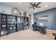 Comfortable office with stylish furniture, a built-in bookcase, and plenty of natural light at 27809 N Silverado Ranch Rd, Peoria, AZ 85383
