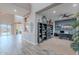 Spacious home office with a built-in bookcase, an elegant desk, and seamless access to the backyard at 27809 N Silverado Ranch Rd, Peoria, AZ 85383