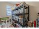 This storage closet features plastic storage bins and wire shelving by a window at 27809 N Silverado Ranch Rd, Peoria, AZ 85383