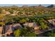 Stunning aerial view of property nestled by golf course, landscaping, and mountain views at 28897 N 94Th Pl, Scottsdale, AZ 85262