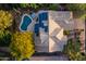 Aerial view of home with pool, hot tub, tiled roof, solar panels and desert landscaping at 28897 N 94Th Pl, Scottsdale, AZ 85262
