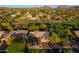 Expansive aerial view of a home with desert landscaping, golf course views, and mountain backdrop at 28897 N 94Th Pl, Scottsdale, AZ 85262