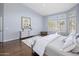 Bedroom with vaulted ceilings, hardwood floors, a large area rug, and natural light at 28897 N 94Th Pl, Scottsdale, AZ 85262