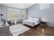 Bright bedroom with vaulted ceiling, hardwood floors, and an area rug at 28897 N 94Th Pl, Scottsdale, AZ 85262