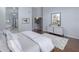 Primary bedroom with ensuite bath, hardwood floors, neutral decor, and ample natural light at 28897 N 94Th Pl, Scottsdale, AZ 85262
