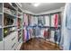 Walk-in closet with custom shelving and hanging racks to maximize storage at 28897 N 94Th Pl, Scottsdale, AZ 85262