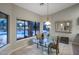 Dining area with glass table looking out to pool and backyard at 28897 N 94Th Pl, Scottsdale, AZ 85262