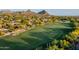Scenic view of lush green golf course surrounded by desert landscape and mountains at 28897 N 94Th Pl, Scottsdale, AZ 85262