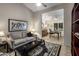 Inviting living room flows to an office with desk, decorative rug, and comfortable seating at 28897 N 94Th Pl, Scottsdale, AZ 85262