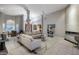 Large, open living area with plenty of natural light, modern fireplace, and stylish decor at 28897 N 94Th Pl, Scottsdale, AZ 85262