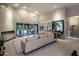 Bright, open living room with fireplace, ceiling fan and sliding doors leading to outdoor living space at 28897 N 94Th Pl, Scottsdale, AZ 85262