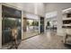 Elegant living room with sliding glass doors that open to the outdoor patio at 28897 N 94Th Pl, Scottsdale, AZ 85262