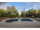 Sparkling pool is surrounded by desert landscaping and beautiful, mature trees at 28897 N 94Th Pl, Scottsdale, AZ 85262