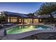 Inviting pool is adjacent to the house and features solar panels, desert landscaping and a hot tub at 28897 N 94Th Pl, Scottsdale, AZ 85262