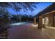 An outdoor patio area is adjacent to a sparkling pool, desert landscaping, and the home at 28897 N 94Th Pl, Scottsdale, AZ 85262