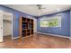 Bedroom boasts a large window, built-in shelves, and easy access to the closet and main door at 3030 E Shangri La Rd, Phoenix, AZ 85028