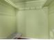 Empty walk-in closet with green walls and a wire shelf perfect for your storage needs at 3030 E Shangri La Rd, Phoenix, AZ 85028
