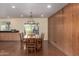 Bright dining room featuring a backyard view and access to the kitchen at 3030 E Shangri La Rd, Phoenix, AZ 85028