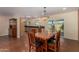 Open concept dining area with stained concrete floors and modern hanging light fixture at 3030 E Shangri La Rd, Phoenix, AZ 85028