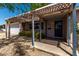 Covered front porch with shade from a wooden pergola at 3030 E Shangri La Rd, Phoenix, AZ 85028