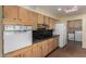 Galley style kitchen with vintage oven and lots of wooden cabinet space at 3030 E Shangri La Rd, Phoenix, AZ 85028