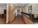 Galley kitchen with granite counters and laundry area access at 3030 E Shangri La Rd, Phoenix, AZ 85028