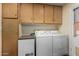 Laundry room with front loading washer and dryer and cabinets at 3030 E Shangri La Rd, Phoenix, AZ 85028