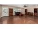 Spacious living room with stained concrete floors, natural light, and ample storage at 3030 E Shangri La Rd, Phoenix, AZ 85028