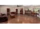 Spacious living room with custom wood cabinets and dining area with backyard view at 3030 E Shangri La Rd, Phoenix, AZ 85028