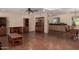 Spacious living room with custom wood cabinets and dining area with backyard view at 3030 E Shangri La Rd, Phoenix, AZ 85028