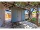 Backyard storage shed with concrete patio and a covered pergola; a practical and stylish addition to the outdoor space at 3030 E Shangri La Rd, Phoenix, AZ 85028