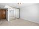 Bedroom featuring a mirrored closet door and neutral colored walls at 3031 N Civic Center Plz # 317, Scottsdale, AZ 85251