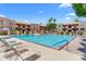 A spacious community pool with ample lounge chairs and well-maintained landscaping at 3031 N Civic Center Plz # 317, Scottsdale, AZ 85251