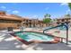 Enjoy the community hot tub, with a nearby pool and lounge seating with mature landscaping at 3031 N Civic Center Plz # 317, Scottsdale, AZ 85251