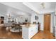 Open-concept kitchen and dining area with granite countertops, stainless steel appliances, and wood flooring at 3031 N Civic Center Plz # 317, Scottsdale, AZ 85251