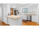 Modern kitchen boasts stainless steel appliances, granite countertops, and wood flooring at 3031 N Civic Center Plz # 317, Scottsdale, AZ 85251