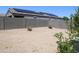 Large backyard showcases desert landscaping and a block wall, providing privacy and enhancing outdoor enjoyment at 30918 W Mulberry W Dr, Buckeye, AZ 85396
