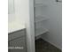 Bathroom features a white vanity, hard surface countertop, and useful shelving at 30918 W Mulberry W Dr, Buckeye, AZ 85396