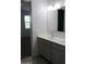Bathroom with double sink vanity and mirror in a new construction home at 30918 W Mulberry W Dr, Buckeye, AZ 85396