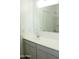 Well lit bathroom includes large mirror, hard surface countertop, and large vanity at 30918 W Mulberry W Dr, Buckeye, AZ 85396