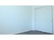 Clean bedroom view showcasing a white closet with sliding doors, offering ample storage space at 30918 W Mulberry W Dr, Buckeye, AZ 85396